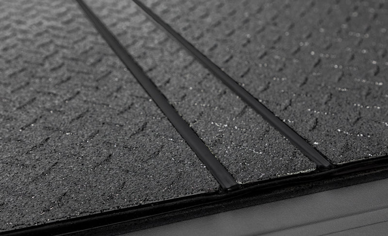 Access 2019+ Chevy/GMC 1500 5ft 8in Bed LOMAX Tri-Fold Cover - Urethane Diamond Plate