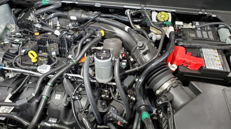 J&L 19-24 Ford/Lincoln SUVs & Trucks w 2.0 EcoBoost Driver Side Oil Separator 3.0 - Clear An