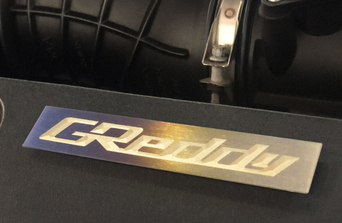 GReddy Titanium Intake Manifold Badge (105mm X 20mm)