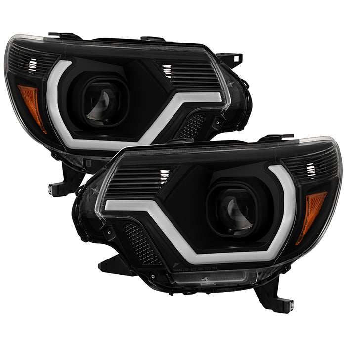 xTune 12-15 Toyota Tacoma Projector Headlights w/ Light Bar - Black (PRO-JH-TTA12-LB-BK)