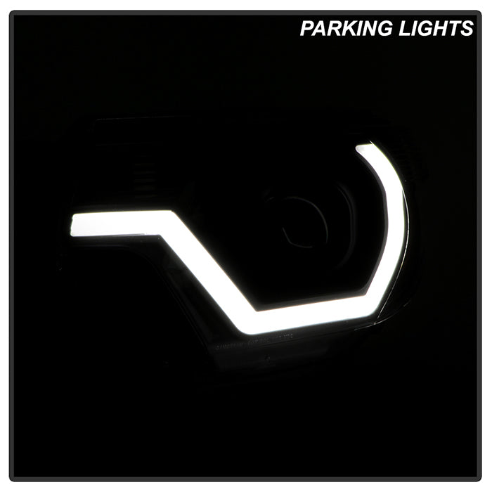 xTune 12-15 Toyota Tacoma Projector Headlights w/ Light Bar - Black (PRO-JH-TTA12-LB-BK)