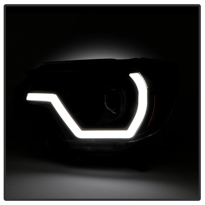 xTune 12-15 Toyota Tacoma Projector Headlights w/ Light Bar - Black (PRO-JH-TTA12-LB-BK)